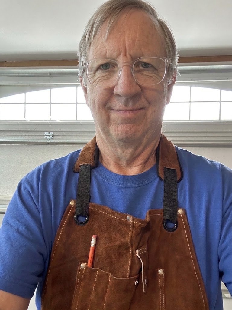 Jim in his leather shop apron