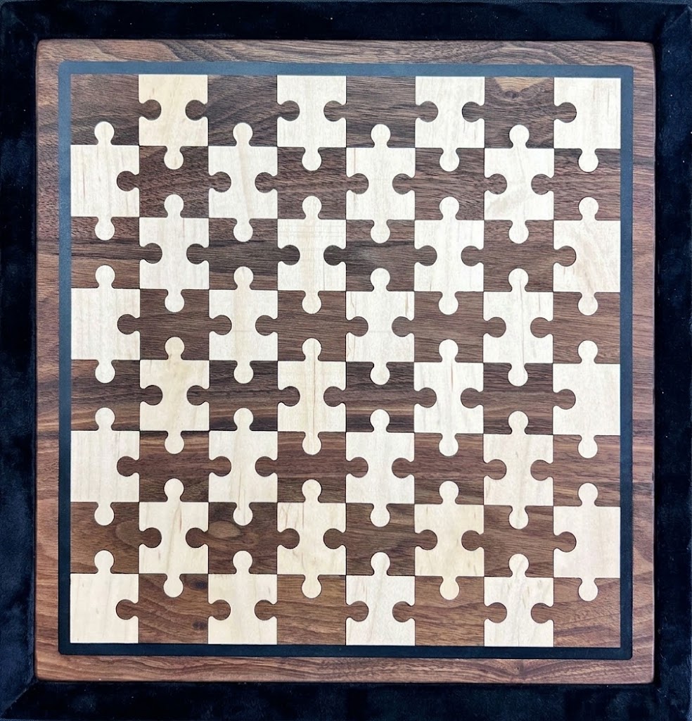 Chess board with an inlaid puzzle-piece pattern